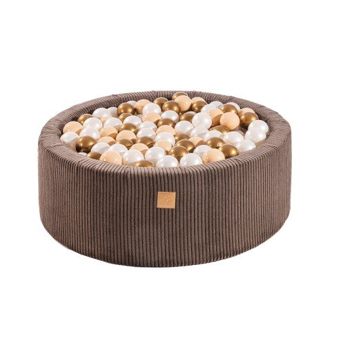 1. Aesthetic brown round ball pit filled with 200 white and copper balls, made from soft hypoallergenic foam, featuring a zippered cover, ideal for children's sensory play and motor skill development.