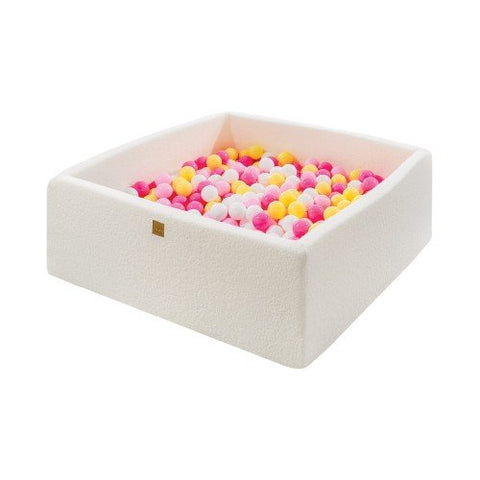 1. MeowBaby white boucle square ball pit filled with pink, yellow, and white balls, shown in a studio setting highlighting soft foam construction and modern design