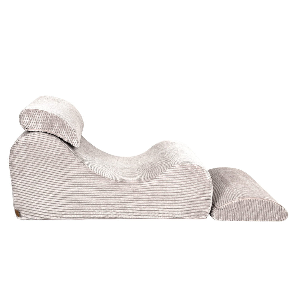 6. Side view of ecru wave lounger with extended footrest and headrest in ribbed fabric