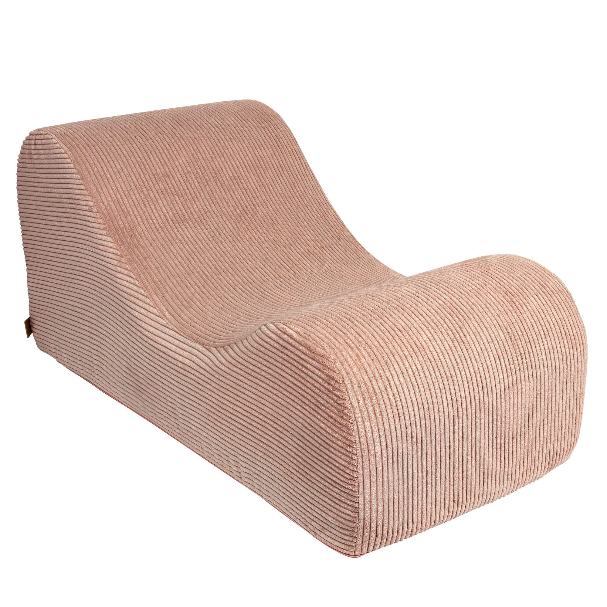 5. Powder rose wave lounger without headrest or footrest in studio setting