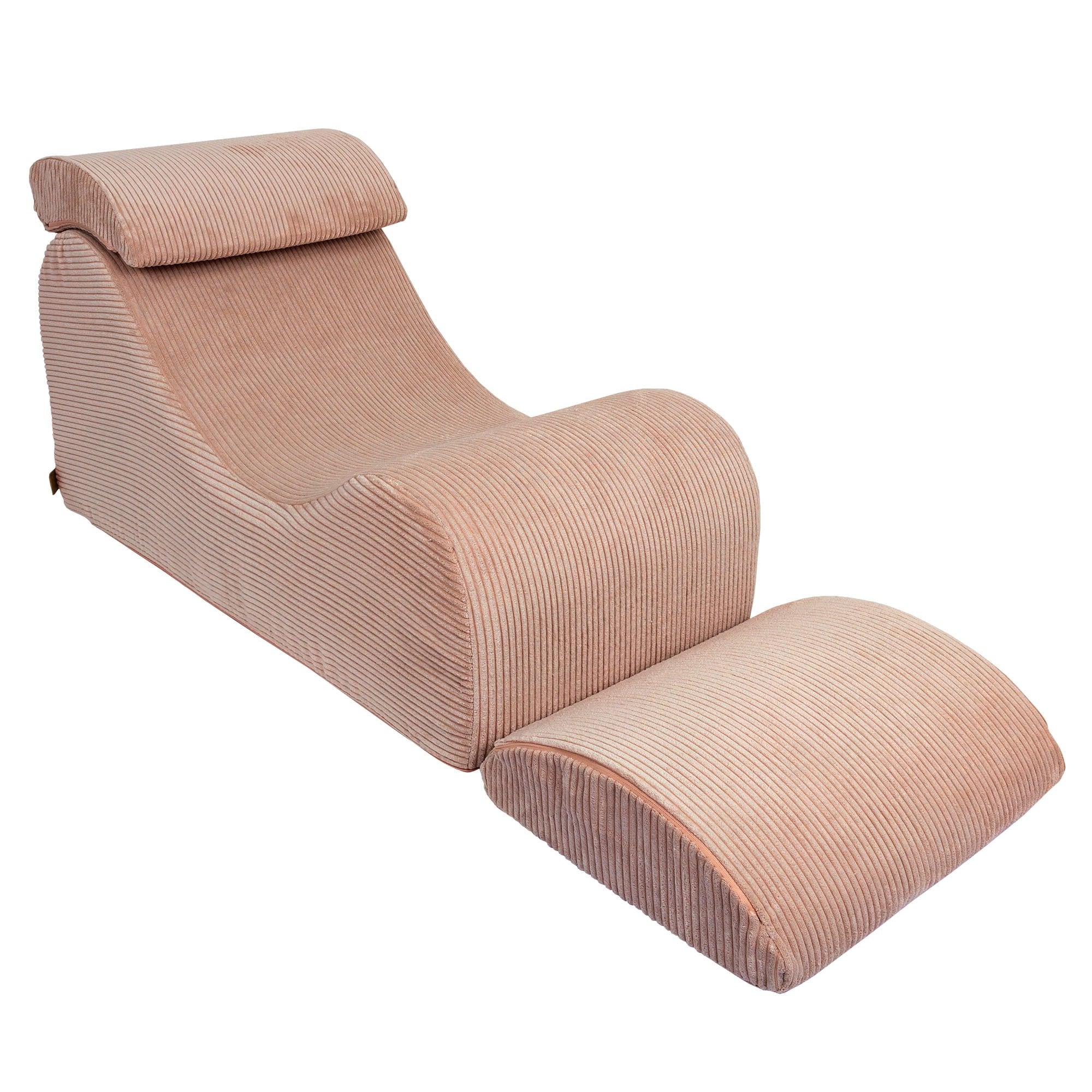 3. Powder rose wave lounger with fully extended footrest and ergonomic headrest in studio setting