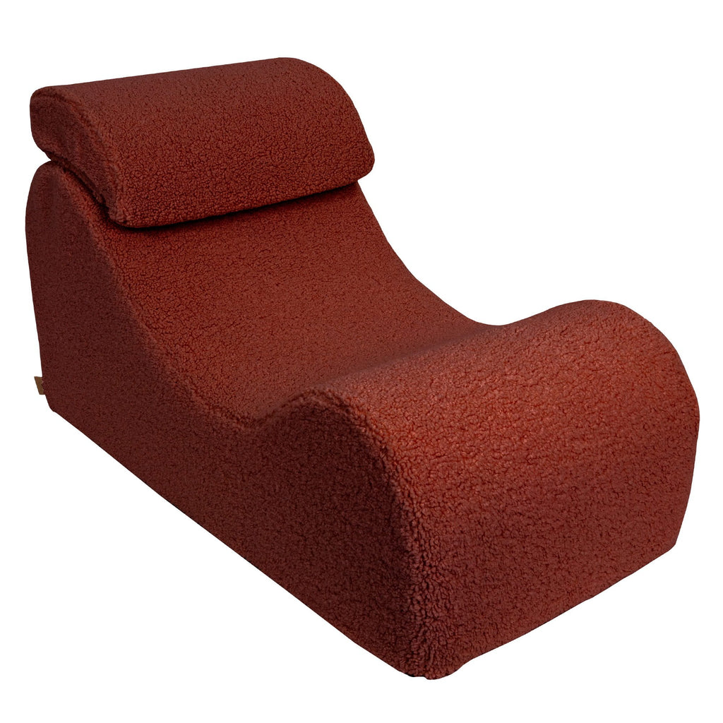 8. Brown Bearly Wave Lounger with headrest, emphasizing ergonomic S-shape in studio