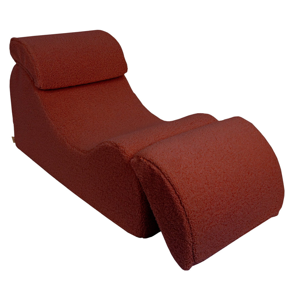 3. Brown Bearly Wave Lounger with adjustable footrest, highlighting contoured shape in studio
