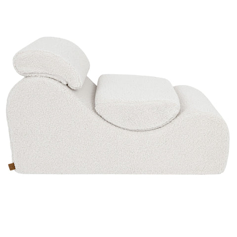 5. Side view of cream Wave Lounger with headrest and seat cushion, emphasizing its ergonomic shape