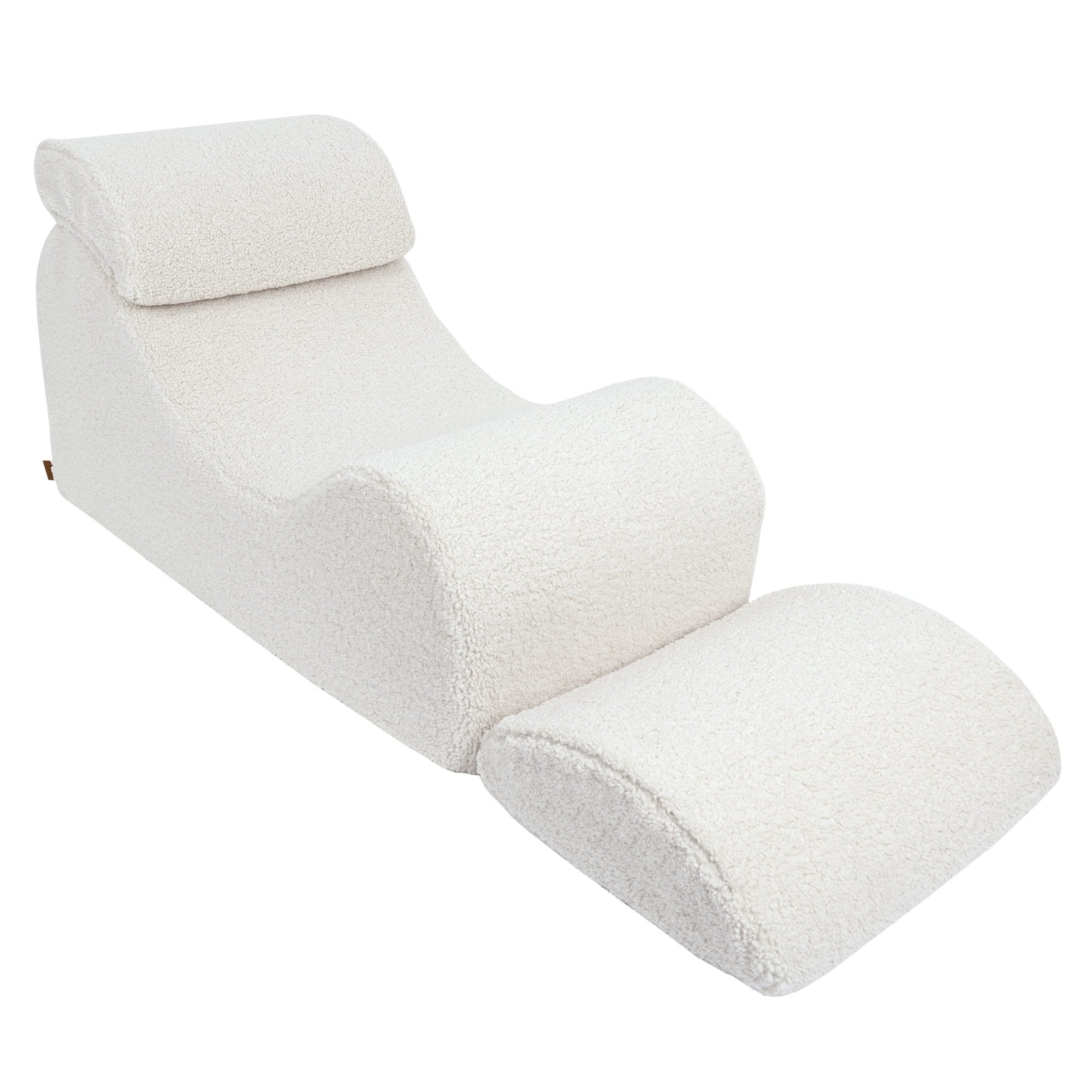 3. Side view of cream Wave Lounger with extended footrest, highlighting its ergonomic design