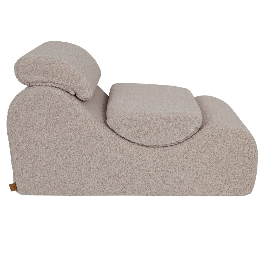4. Side view of light grey Wave Lounger with ergonomic headrest and contoured seat