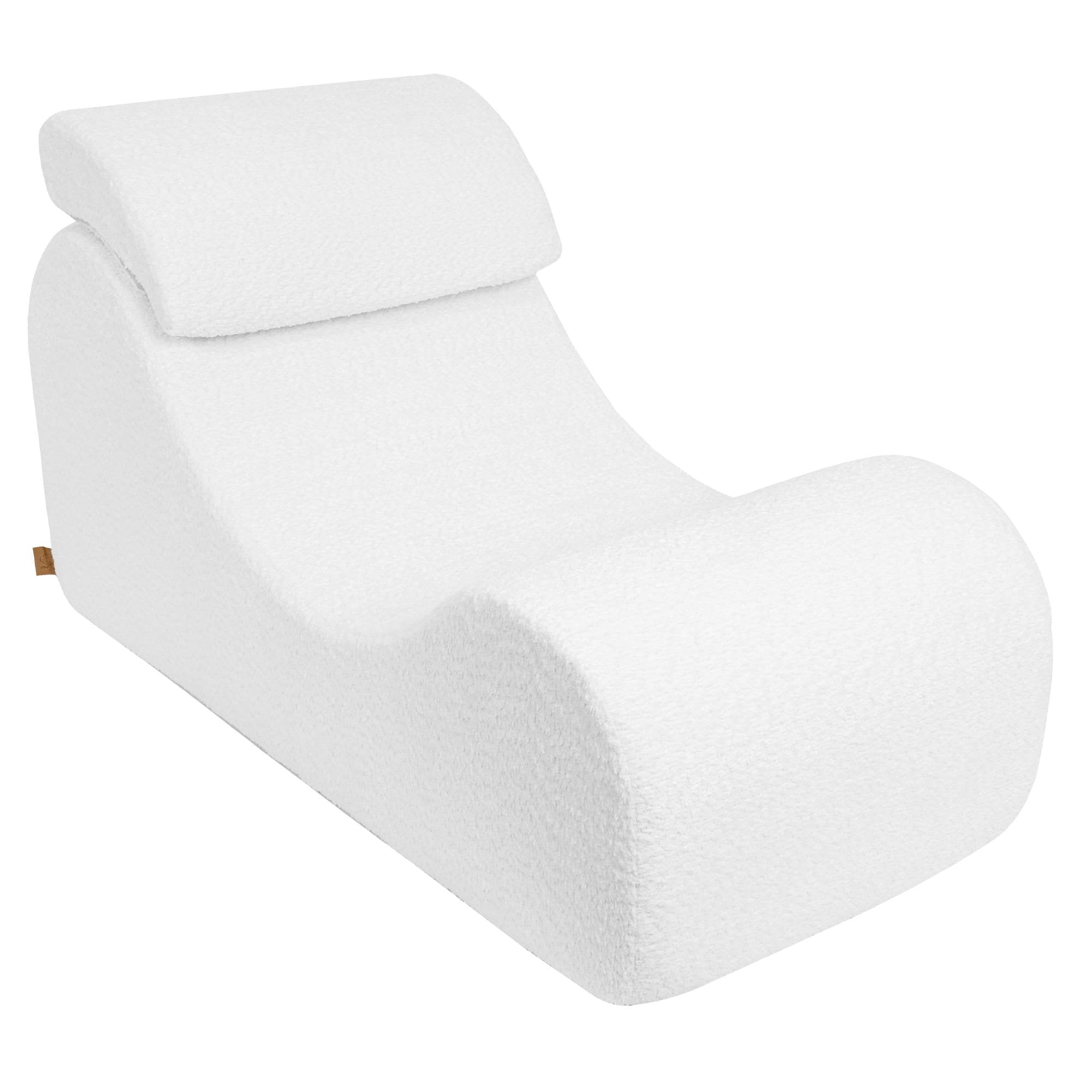 5. White boucle Wave Lounger with ergonomic S-shape and removable headrest, shown from a side angle