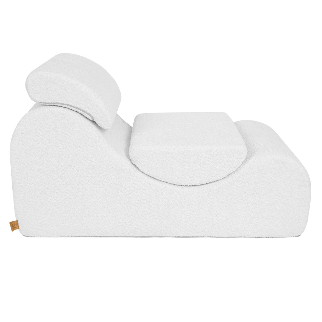 8. White boucle Wave Lounger with headrest and footrest in neutral position, showcasing its ergonomic contour from a side view