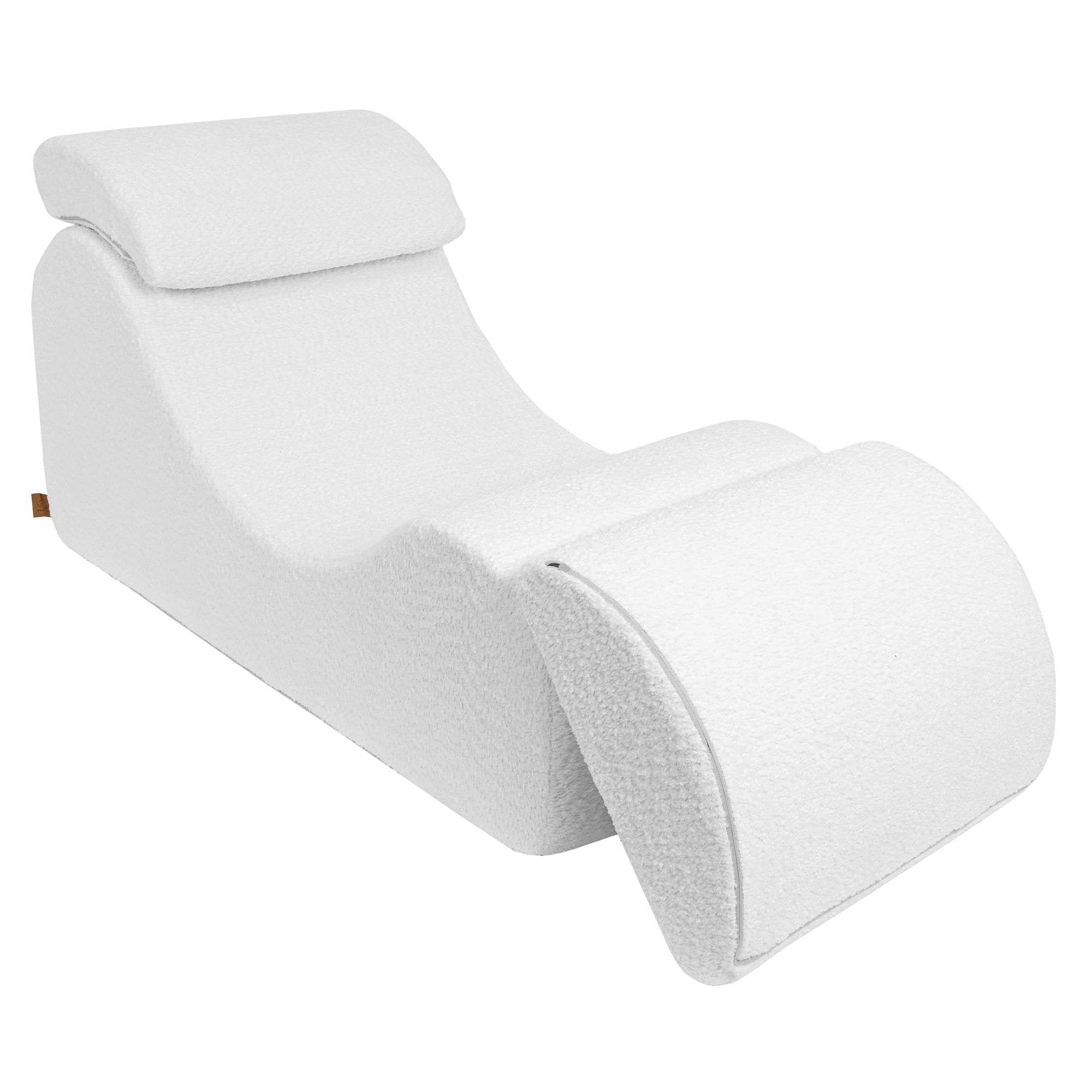 2. White boucle Wave Lounger with extended footrest, showcasing its adjustable ergonomic design from a side angle