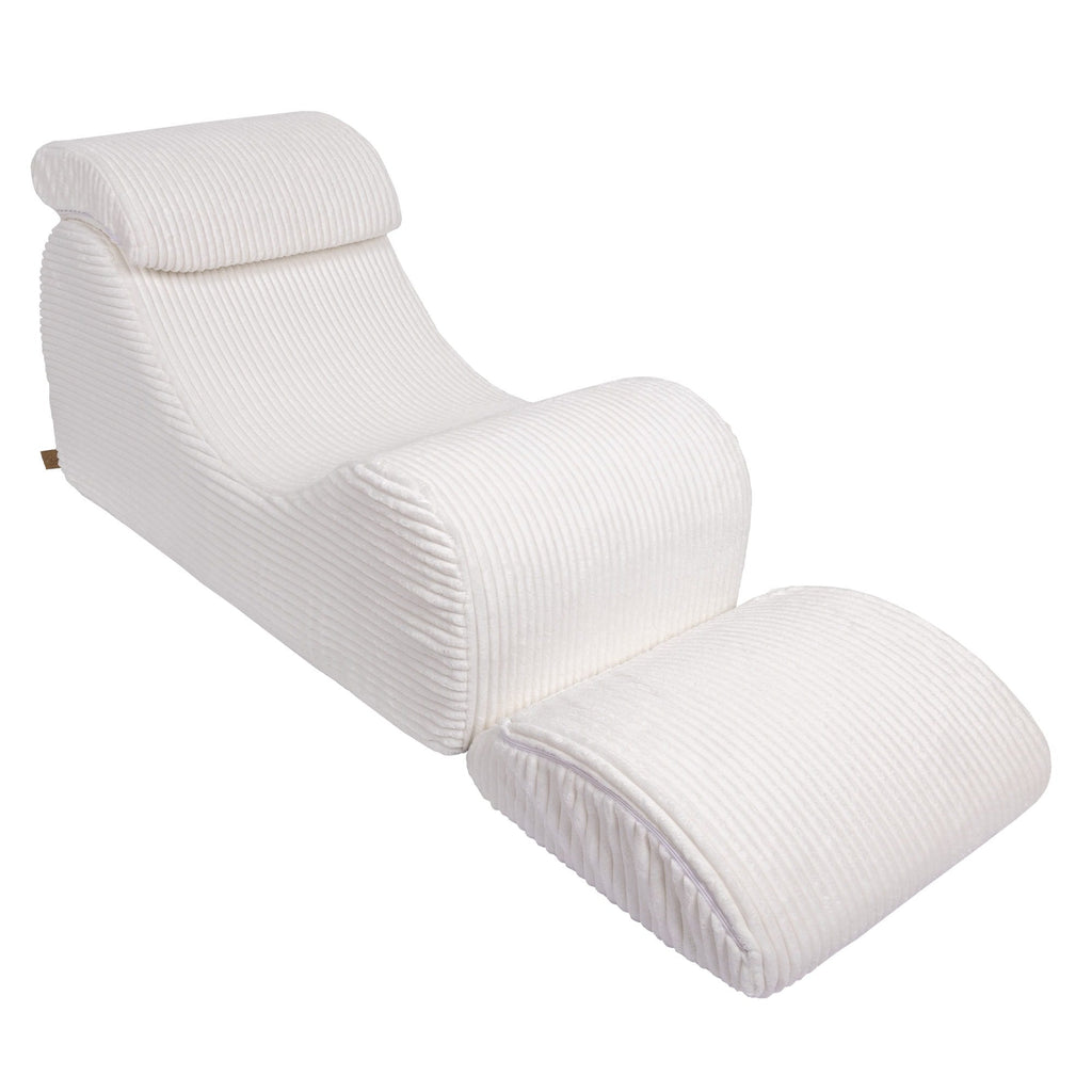 5. White furrycord Wave Lounger with extended footrest, emphasizing comfort and design
