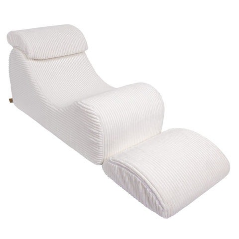 5. White furrycord Wave Lounger with extended footrest, emphasizing comfort and design