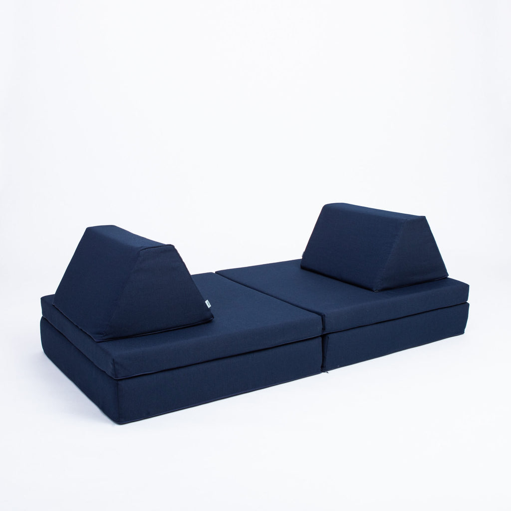 2. Navy blue play mattress set with two trapezoidal pillows on a white background