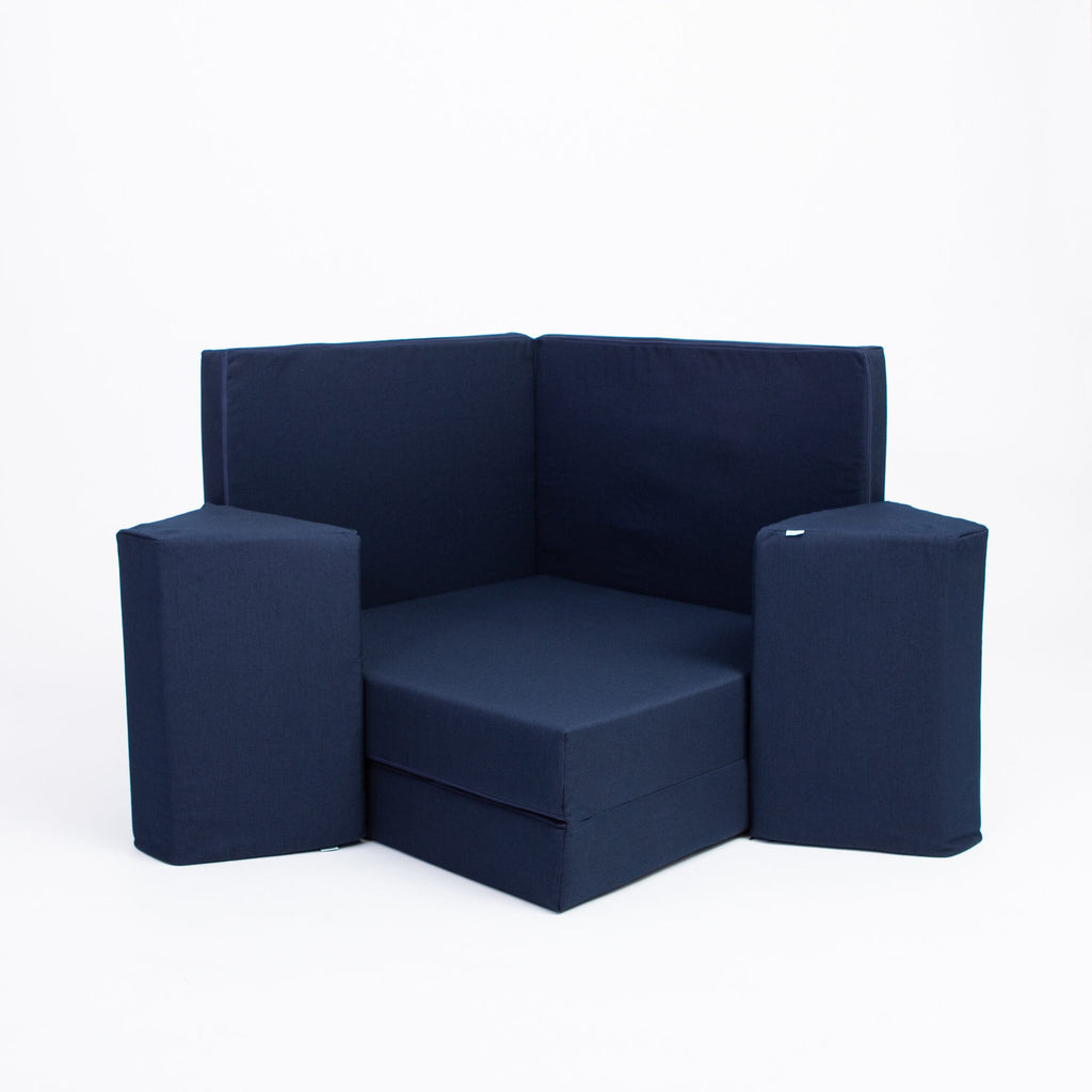 2. Navy blue play mattress set arranged in a corner configuration with trapezoidal pillows on a white background