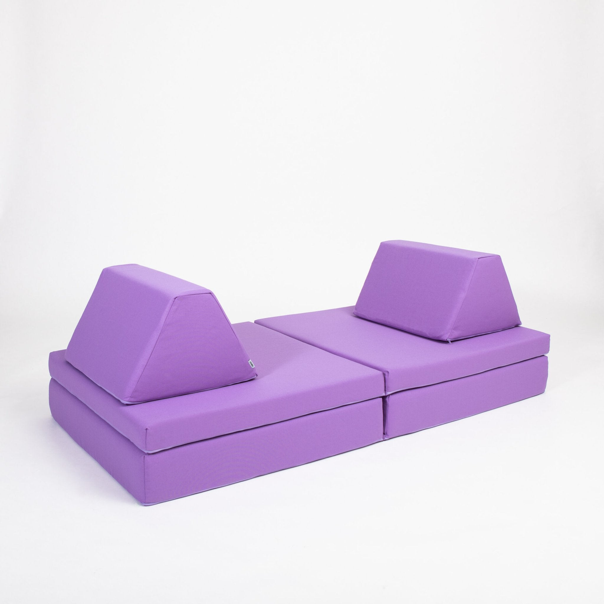 2. Purple activity play mattress set with trapezoidal pillows arranged flat on a white background
