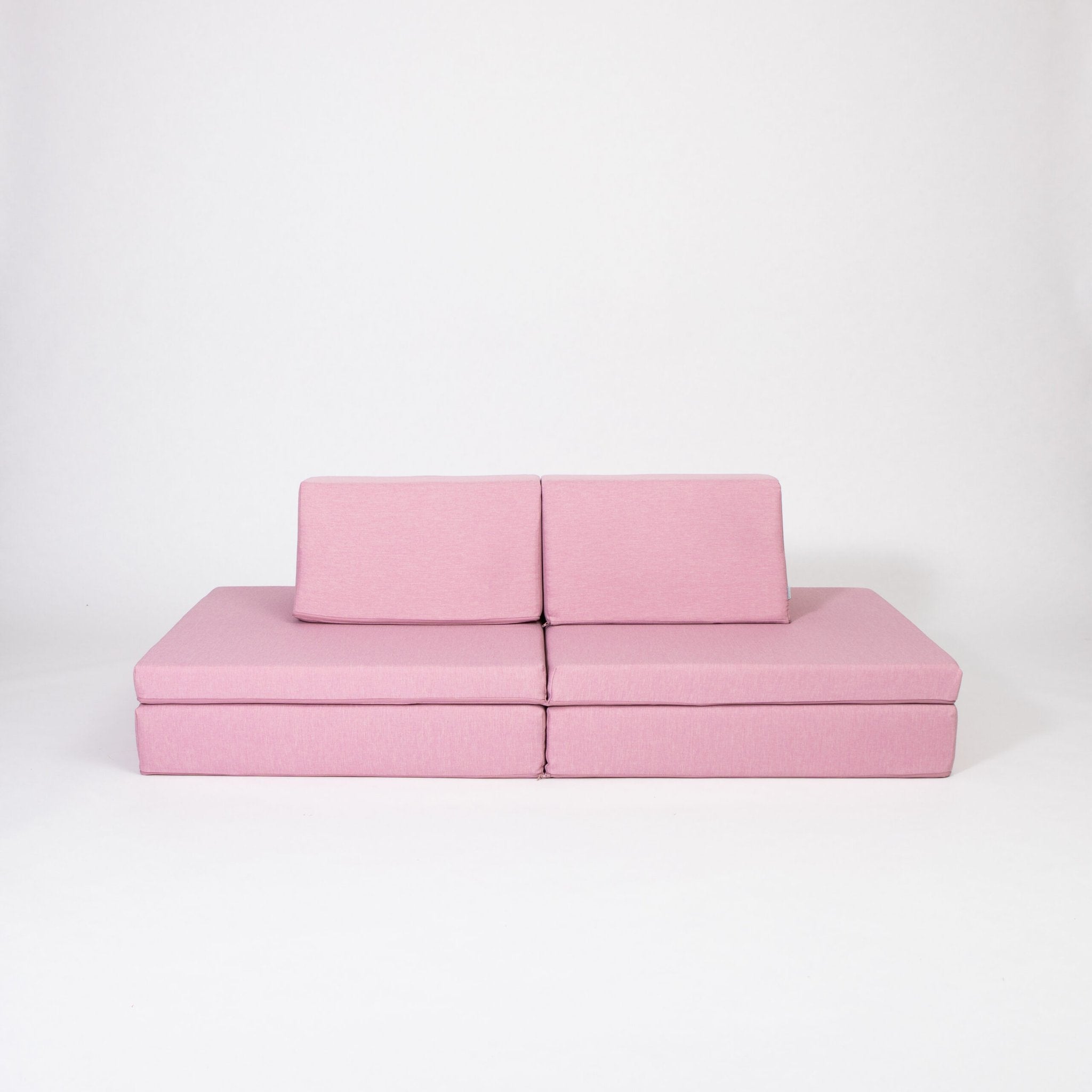 2. Pink activity play mattress set with two trapezoidal pillows on a white background