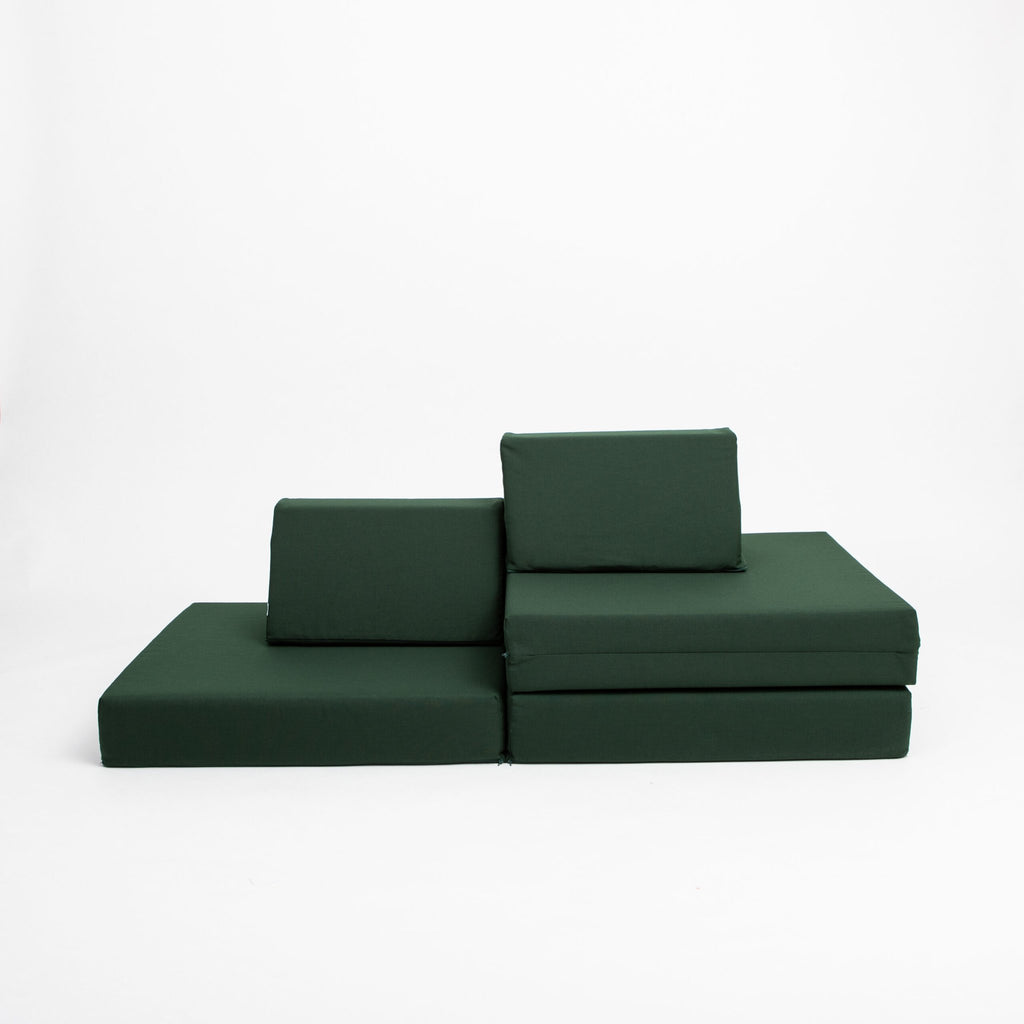 2. Monboxy deep green play mattress set in a staggered sofa arrangement