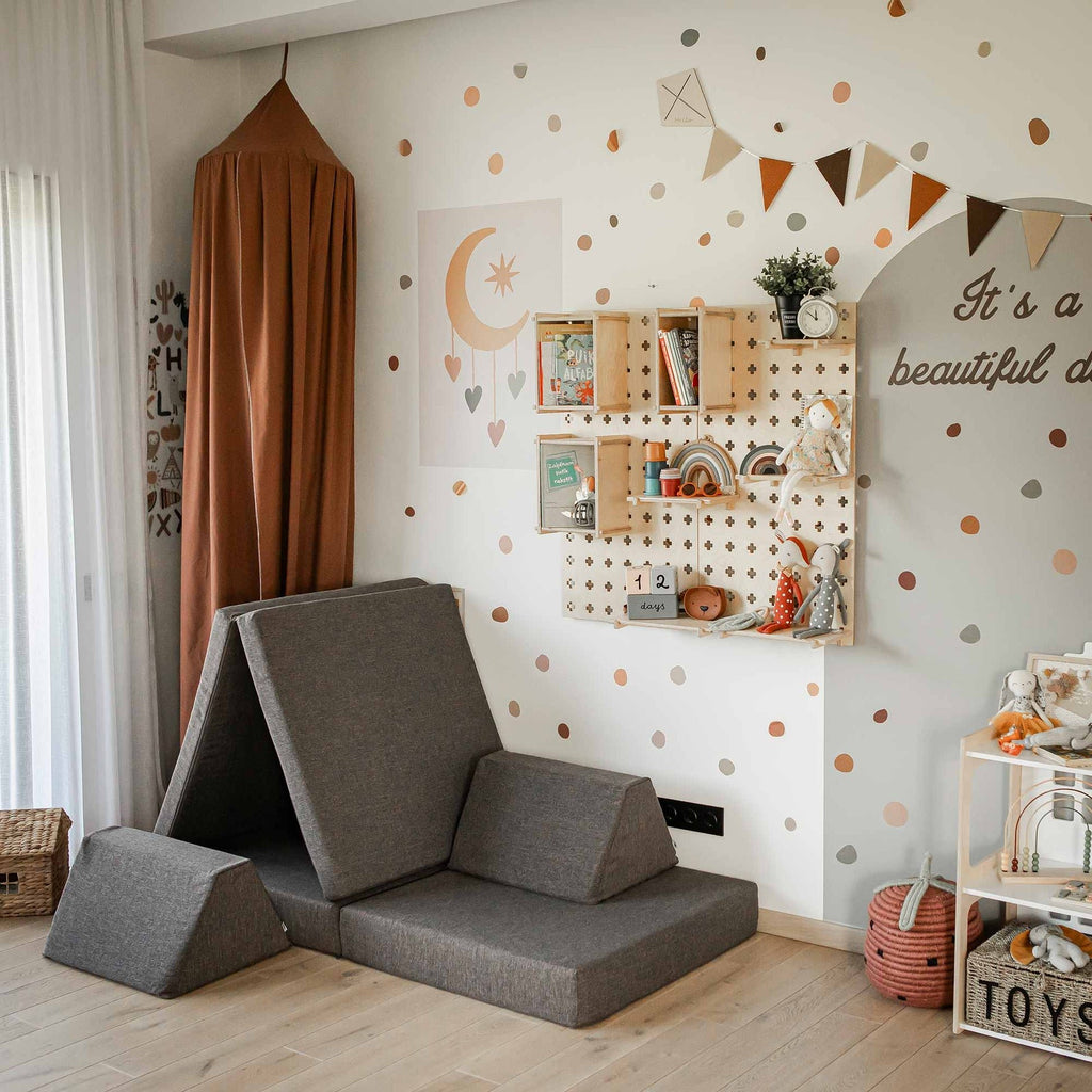 8. Monboxy dark brown play mattress set arranged in a creative shape in a decorated children's room