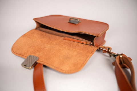 4. Close-up of interior of leather saddle bag mini by Zelma Kraft, showing compartments and zipper pocket