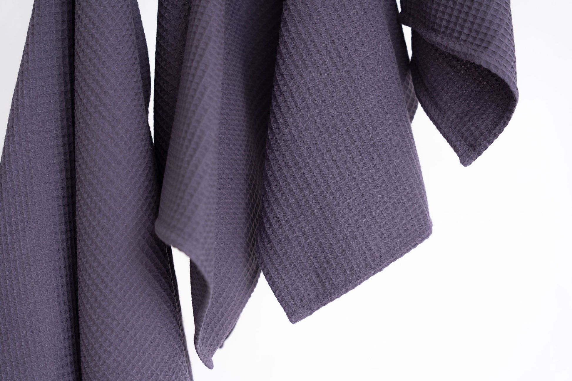 4. Close-up of purple waffle texture on cotton towels showing fabric detail