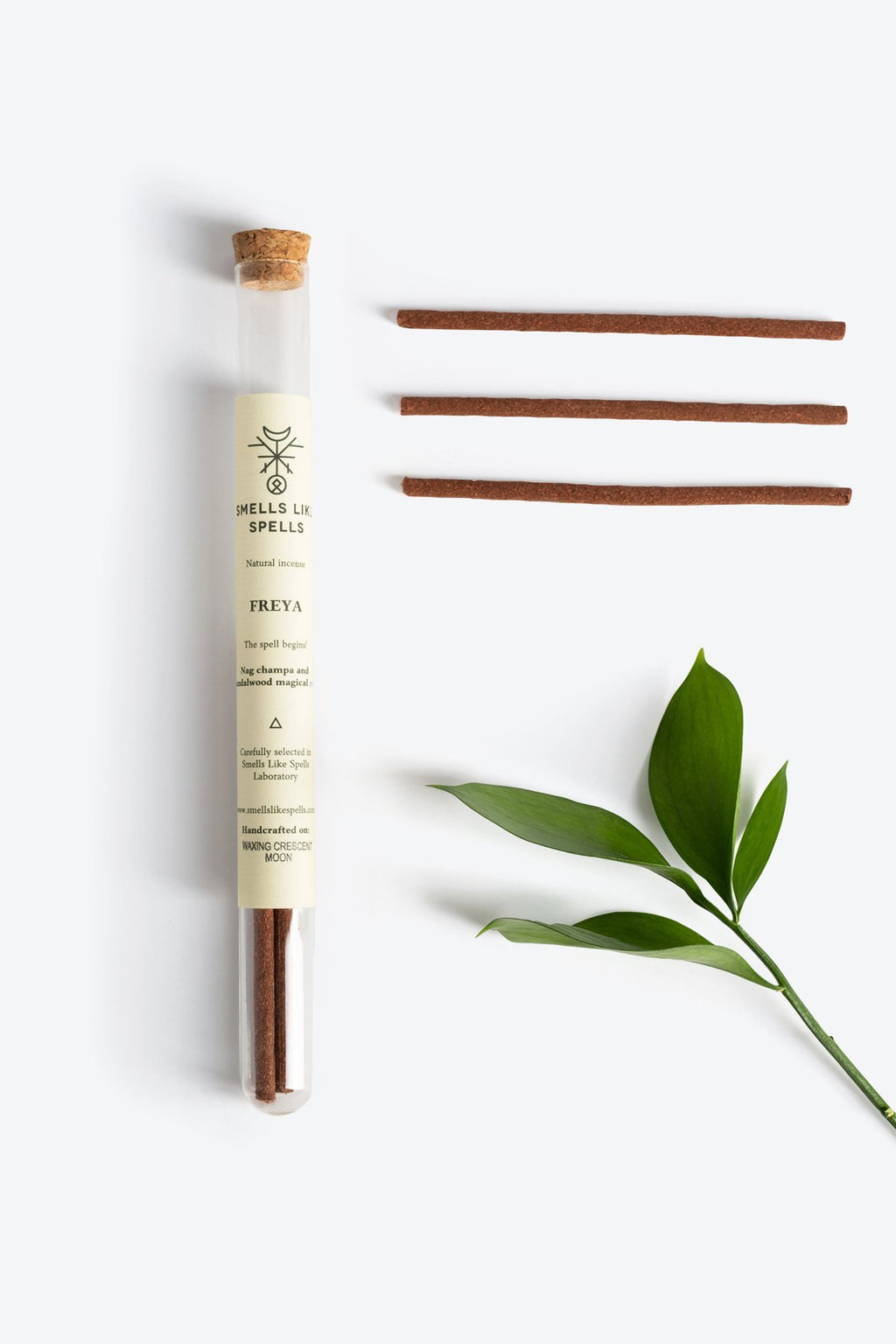 2. Smells Like Spells Natural Incense FREYA with green leaf accent, studio setting