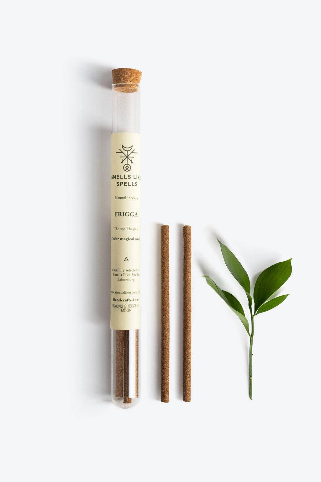1. Smells Like Spells Natural Incense FRIGGA with cedar sticks and green leaf, shown in flat lay