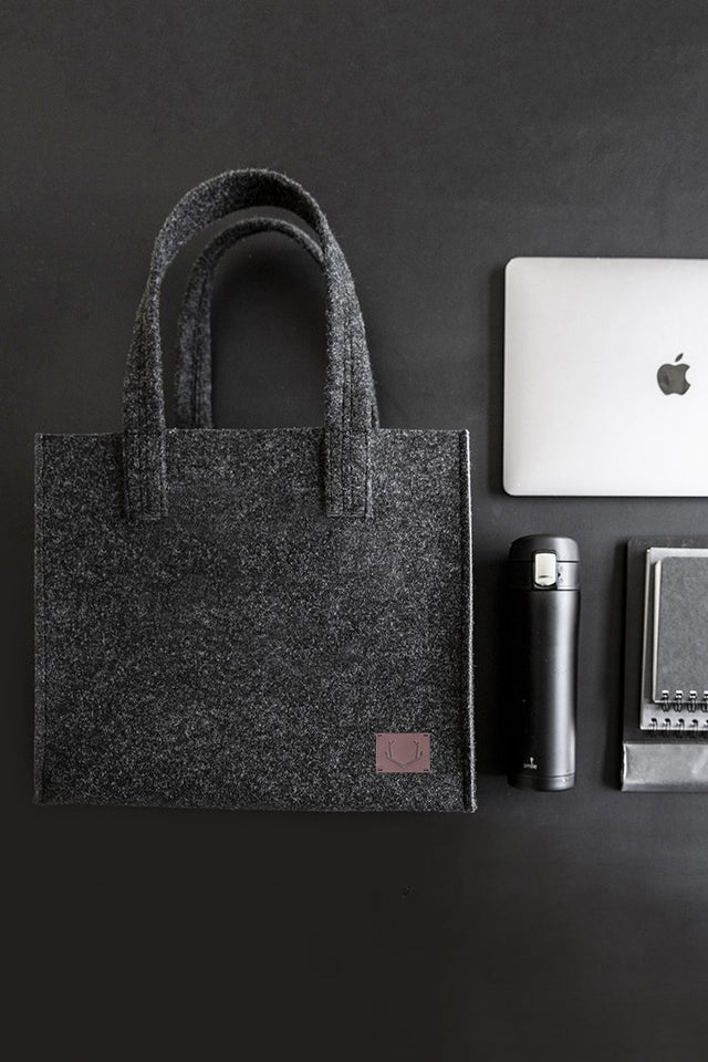 4. Unisex black Office Bag Holm by Nordhale with laptop and accessories, emphasizing organization and style
