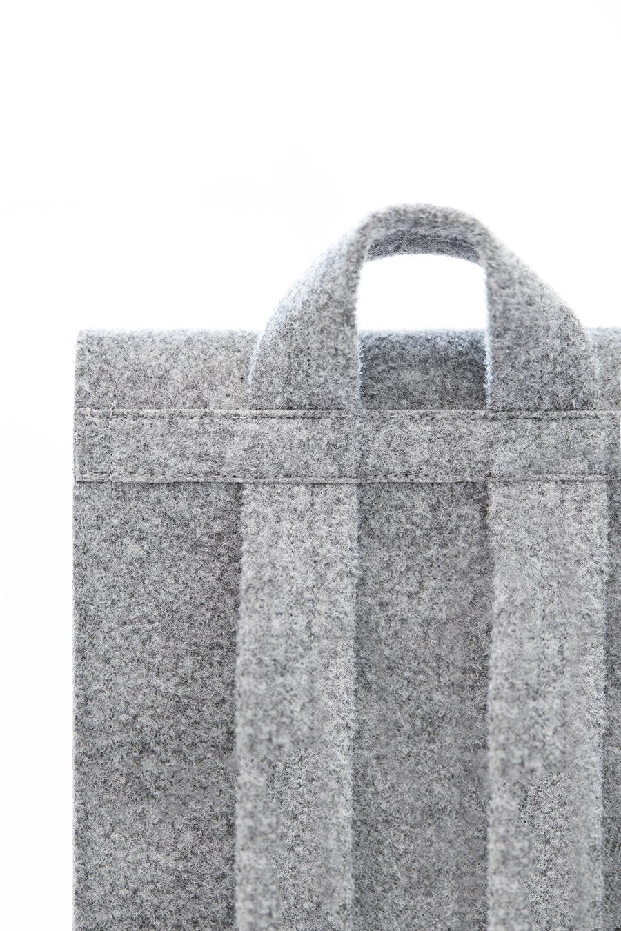 7. Side view of Nordhale Backpack Lund in grey, emphasizing sleek and minimalist aesthetic