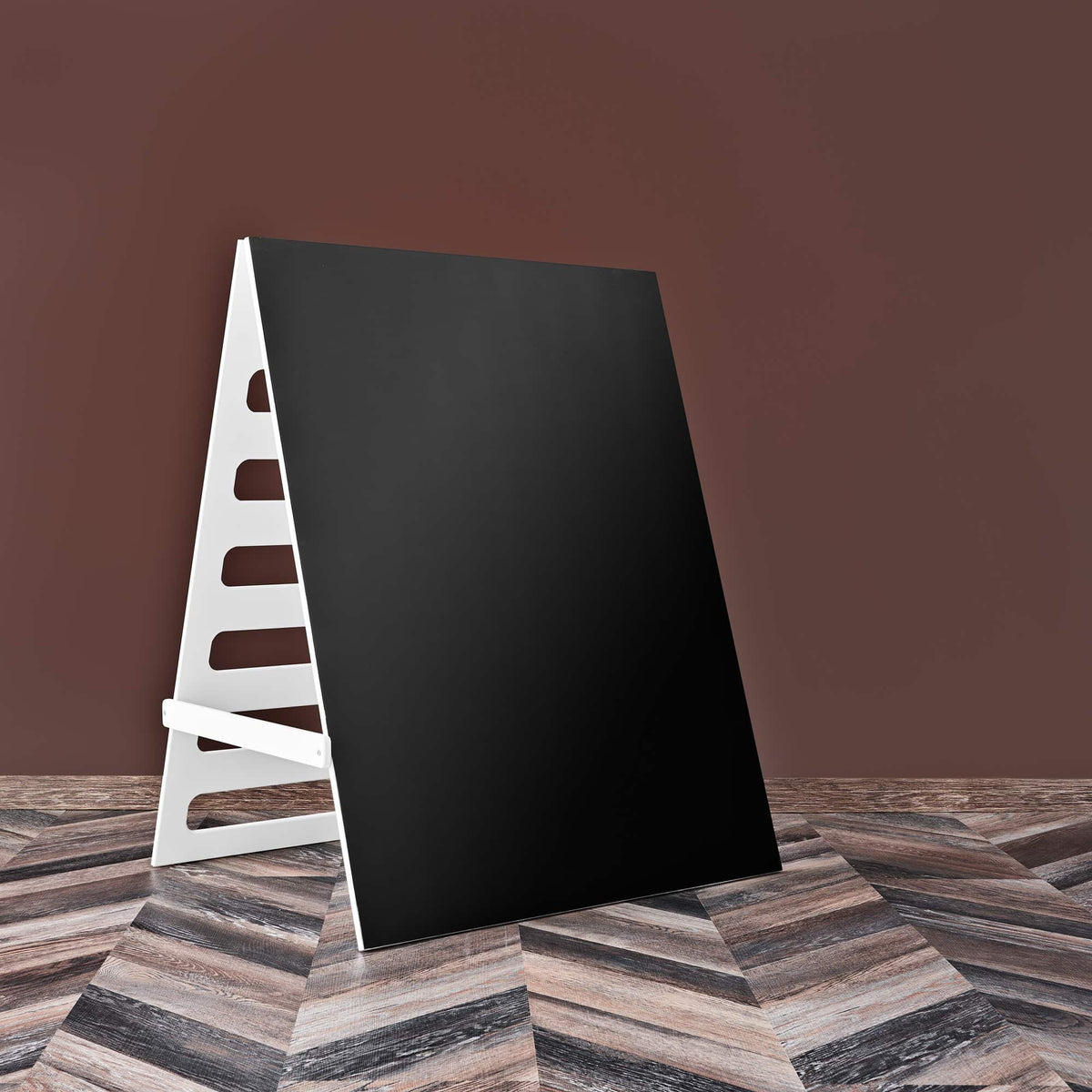 6. Blackboard with white frame on dark wood floor and brown background