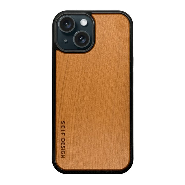 2. Wooden iPhone cover in oak by Seif Design with precision cutouts for camera and buttons, featuring engraved brand logo, shown on black background