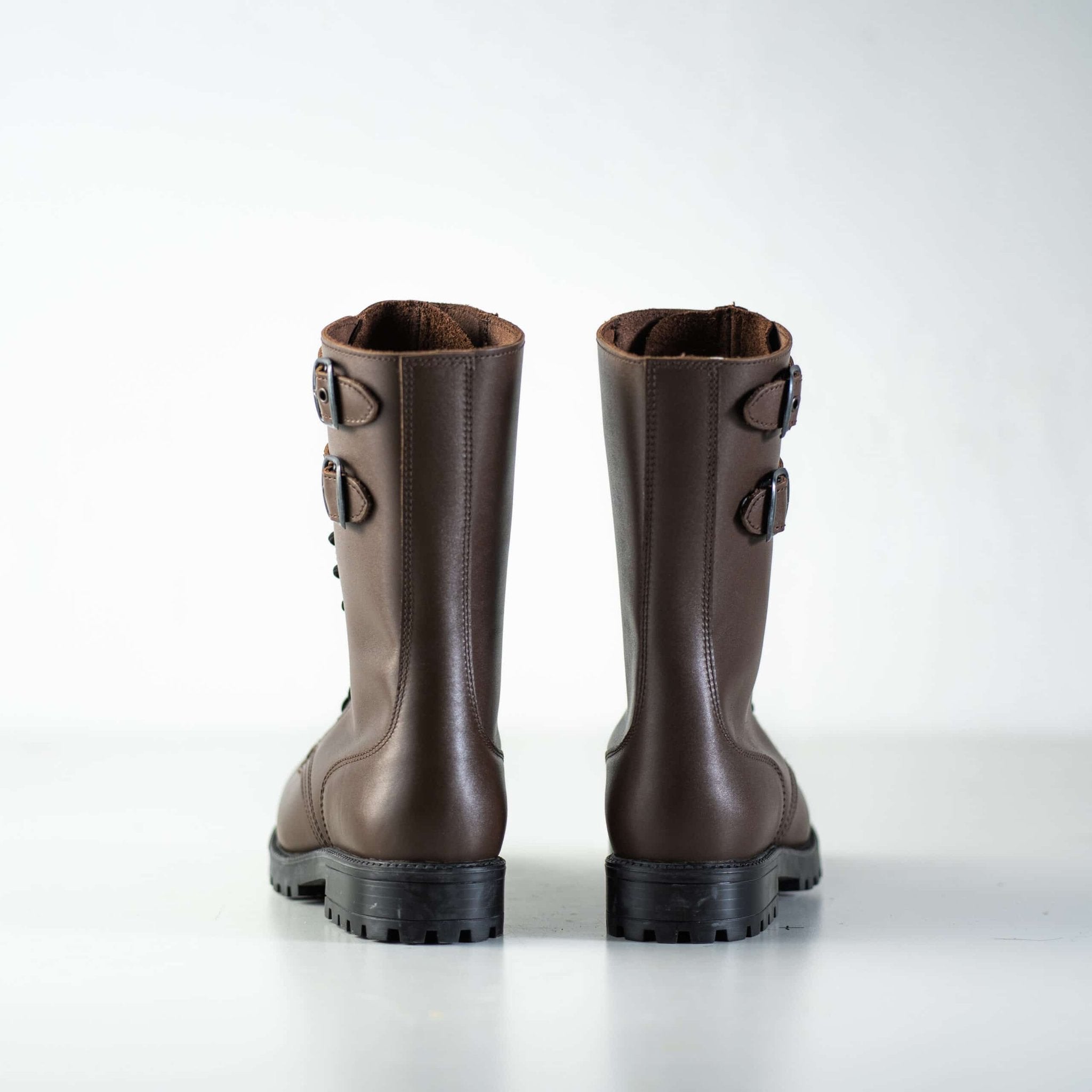 3. Back view of unisex Tarkovsky Boots in dark brown leather, highlighting buckle straps and rugged sole
