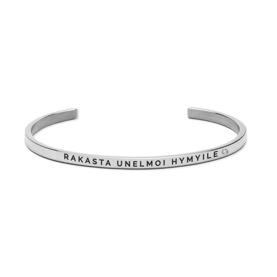 2. Studio image of Olla SEURAA UNELMIASI bracelet in silver with engraved message 'RAKASTA UNELMOI HYMYILE'