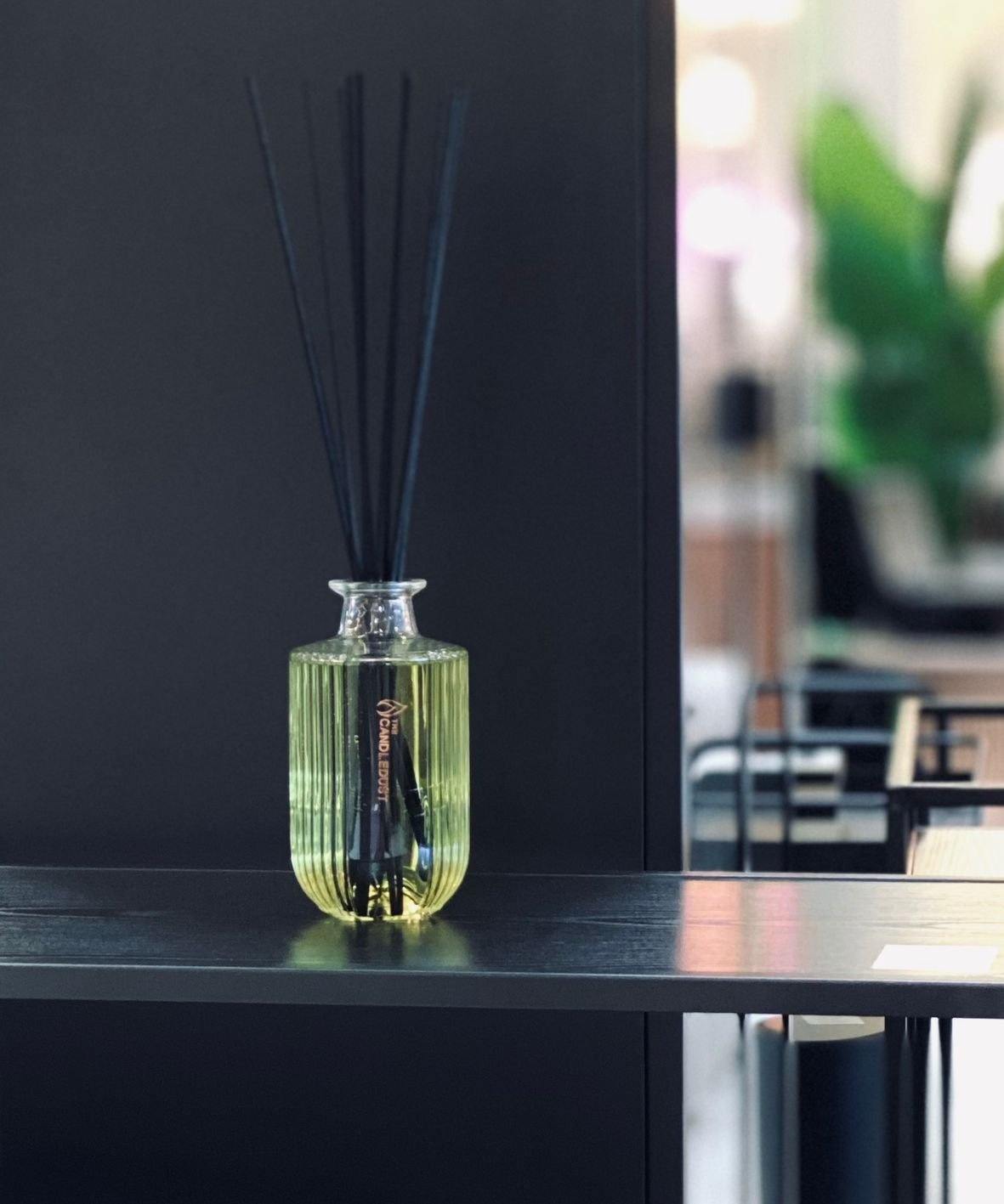 9. Candledust Breeze room diffuser on sleek black shelf with ambient lighting