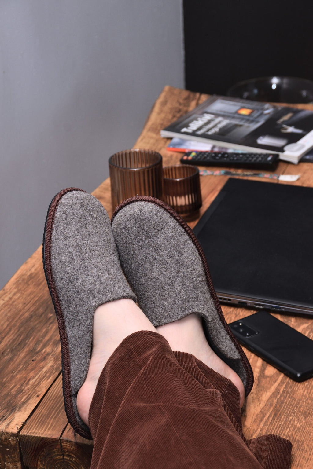 2. Unisex Nursi slippers by Omaking worn indoors, highlighting comfort and style