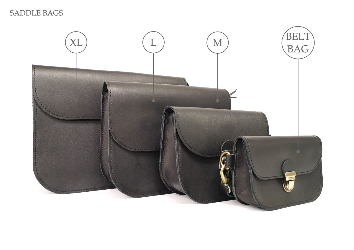 9. Woman holding three Zelma Kraft red leather bags of different sizes, highlighting versatility and style