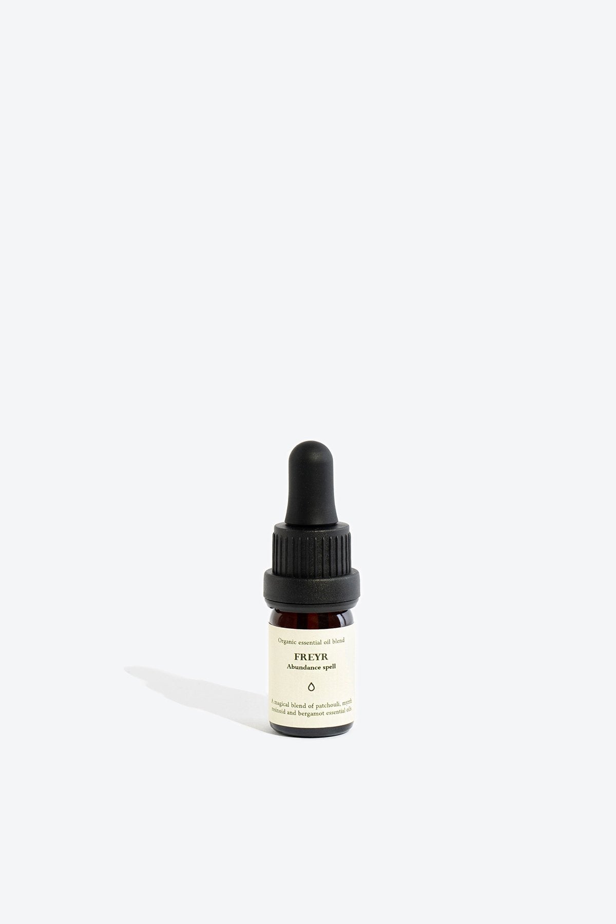 2. Smells Like Spells FREYR essential oil blend dropper bottle on white background