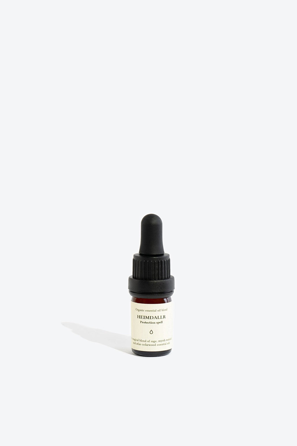 3. Smells Like Spells HEIMDALLR essential oil blend in 5 ml glass bottle with pipette, studio shot