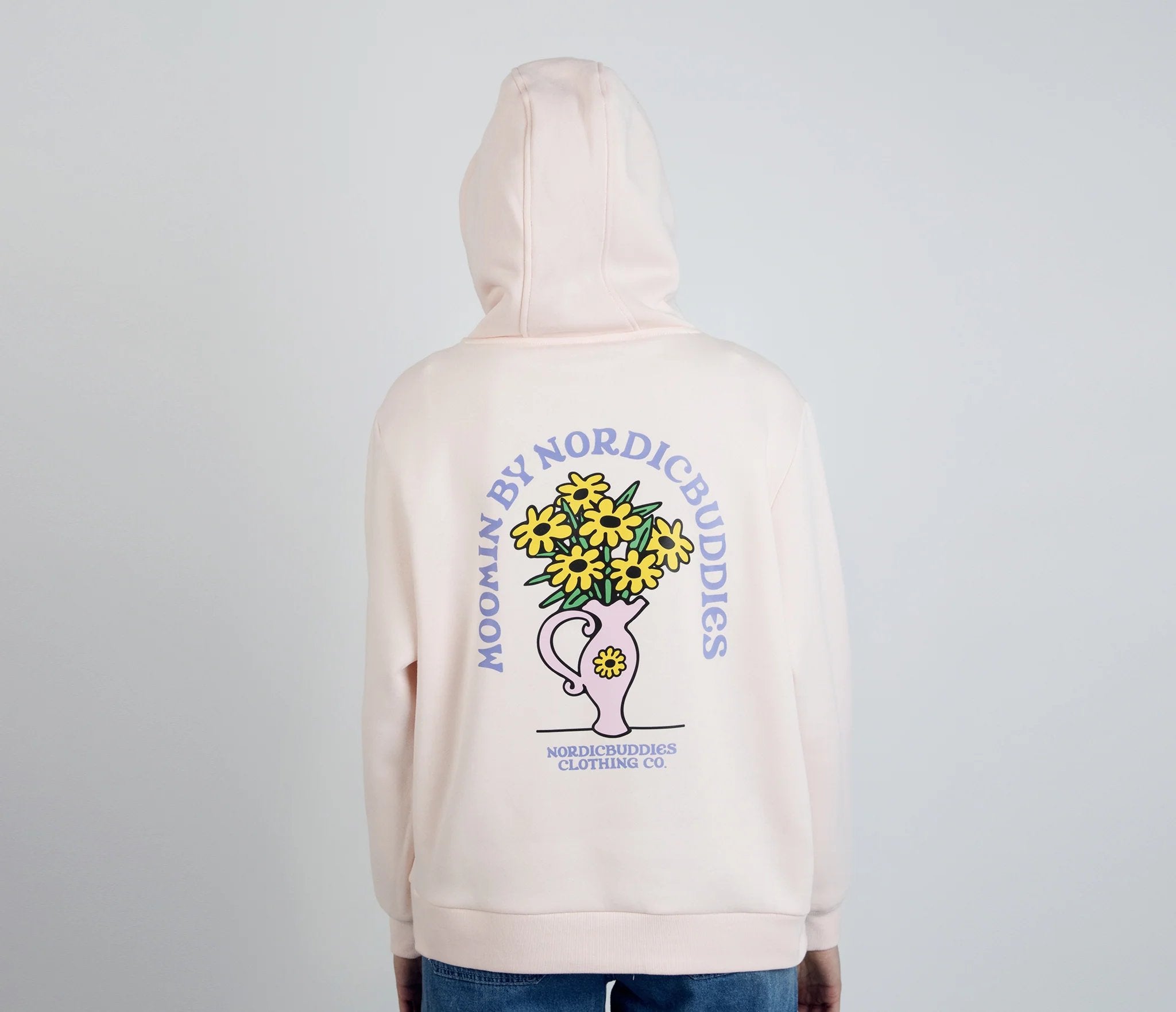 2. Back view of women's light pink Sniff Flower Bouquet Hoodie by Moomin, worn by model in studio