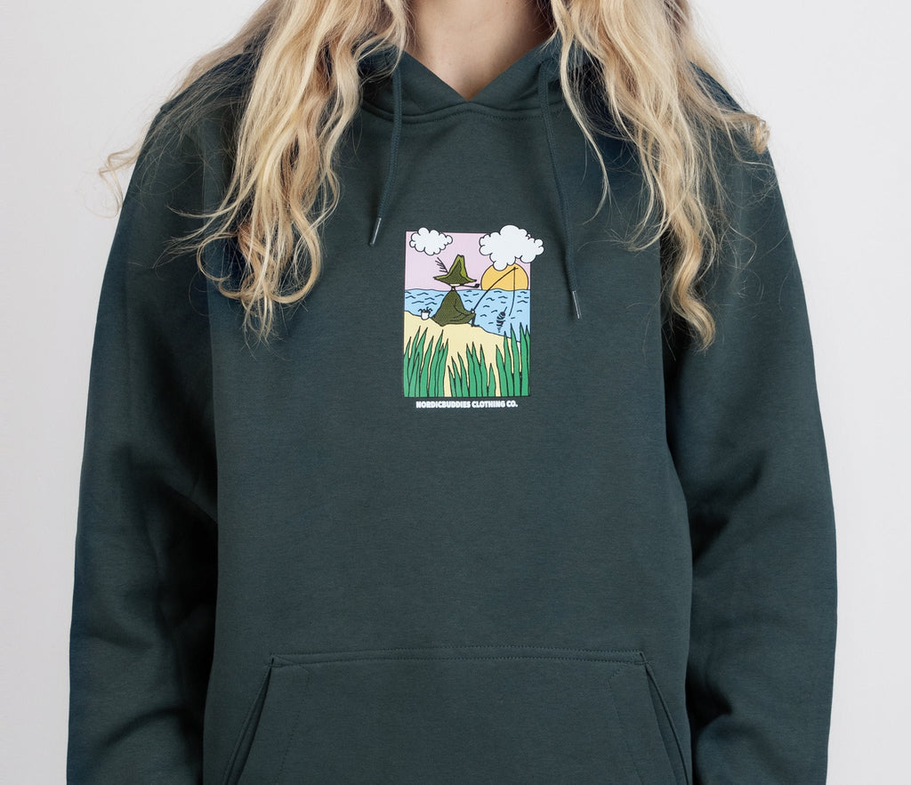 1. Women's dark green Snufkin Fishing Hoodie by Moomin, featuring colorful front graphic, shown in studio