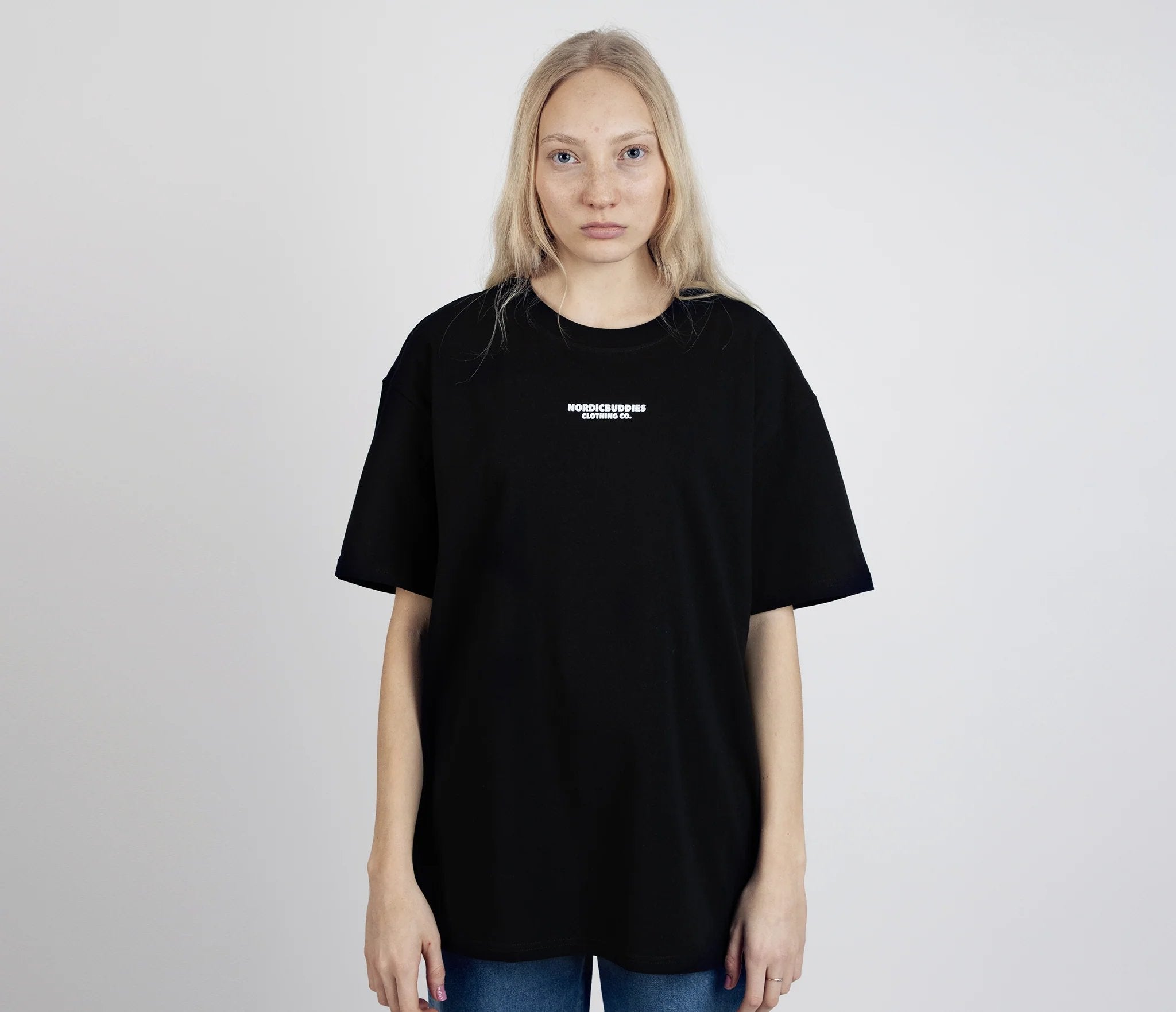 6. Women's Snufkin Fishing T-Shirt by Moomin, front view with logo, studio setting