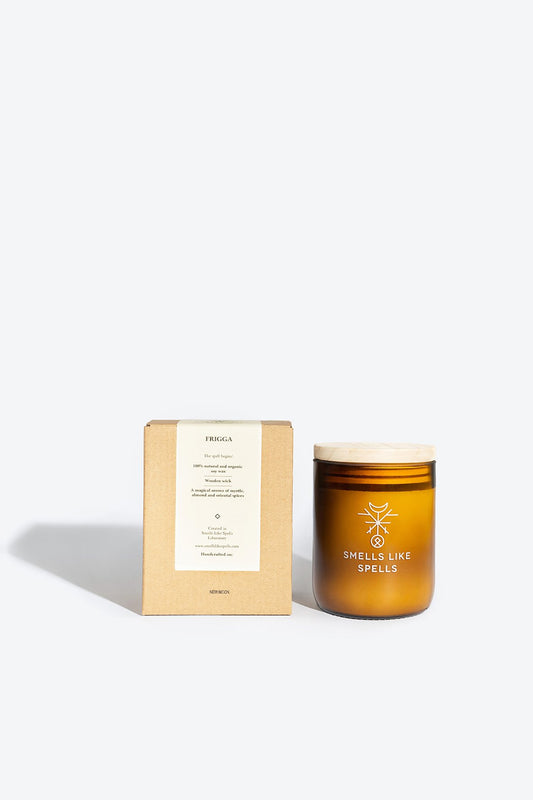 1. Smells Like Spells FRIGGA scented candle in amber glass jar with packaging, featuring wooden wick and soy wax for a natural burn