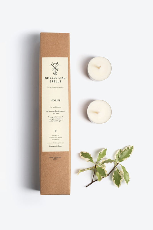 1. Smells Like Spells Scented Tealight Candles NORNS with soy wax and essential oils, shown with packaging and greenery