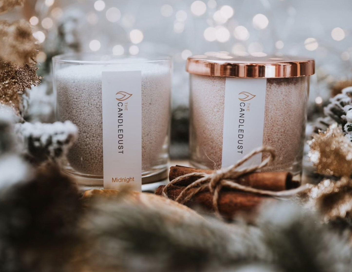 3. Candledust Midnight powdered candle with rose gold lid, styled with festive decor
