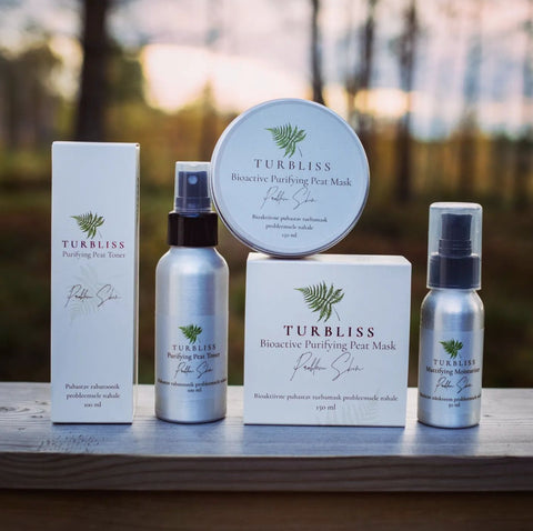 2. Turbliss Light Moisturizer 50ml held by adult hand with cream applied on baby's arm, showcasing gentle formula