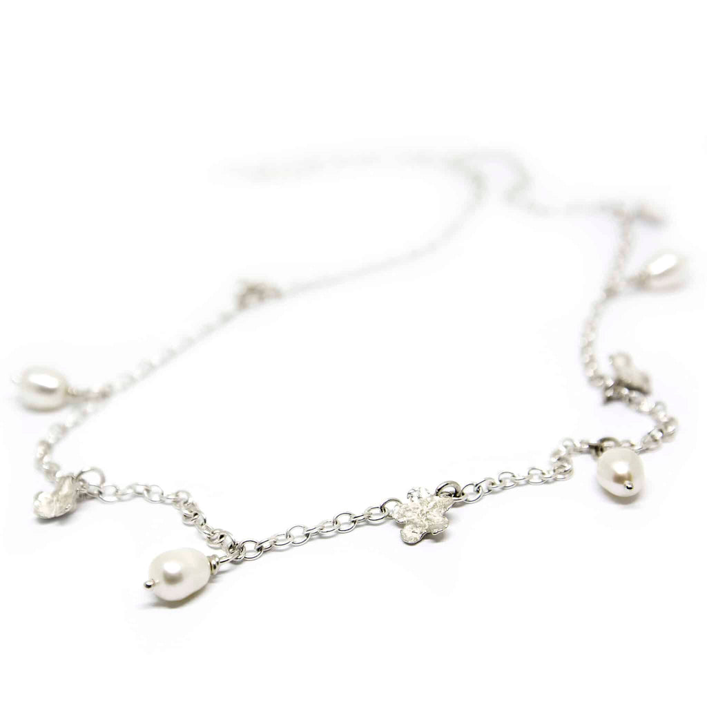 2. Studio shot of SPRING Myosotis Necklace by Agnes Veski Jewellery featuring pearls and floral design