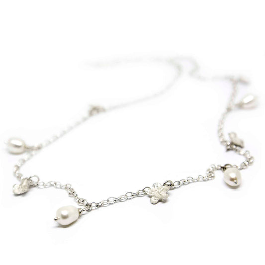 2. Studio shot of SPRING Myosotis Necklace by Agnes Veski Jewellery featuring pearls and floral design