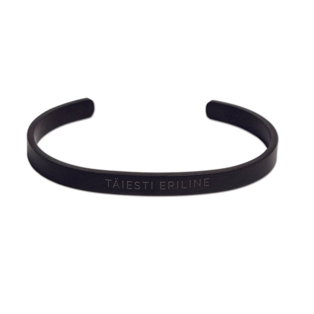 2. Matte black men's bracelet with 'TÄIESTI ERILINE' engraving on clean white background