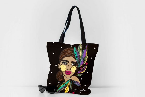 6. Garbanota HANDBAG LILY - COLORED with artistic print, displayed with sunglasses in studio