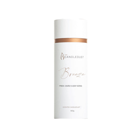 2. Candledust Powder Candle - Breeze in white and copper packaging, studio shot