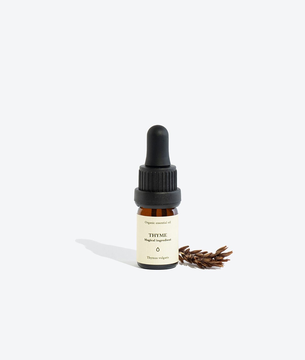 3. Smells Like Spells THYME Essential Oil bottle with thyme sprig, studio shot