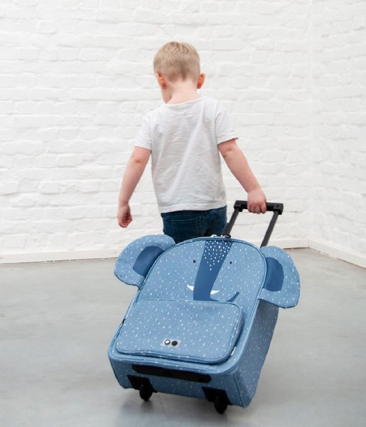 1. Child pulling Trixie Baby Mr Elephant travel trolley with blue elephant design, highlighting easy maneuverability